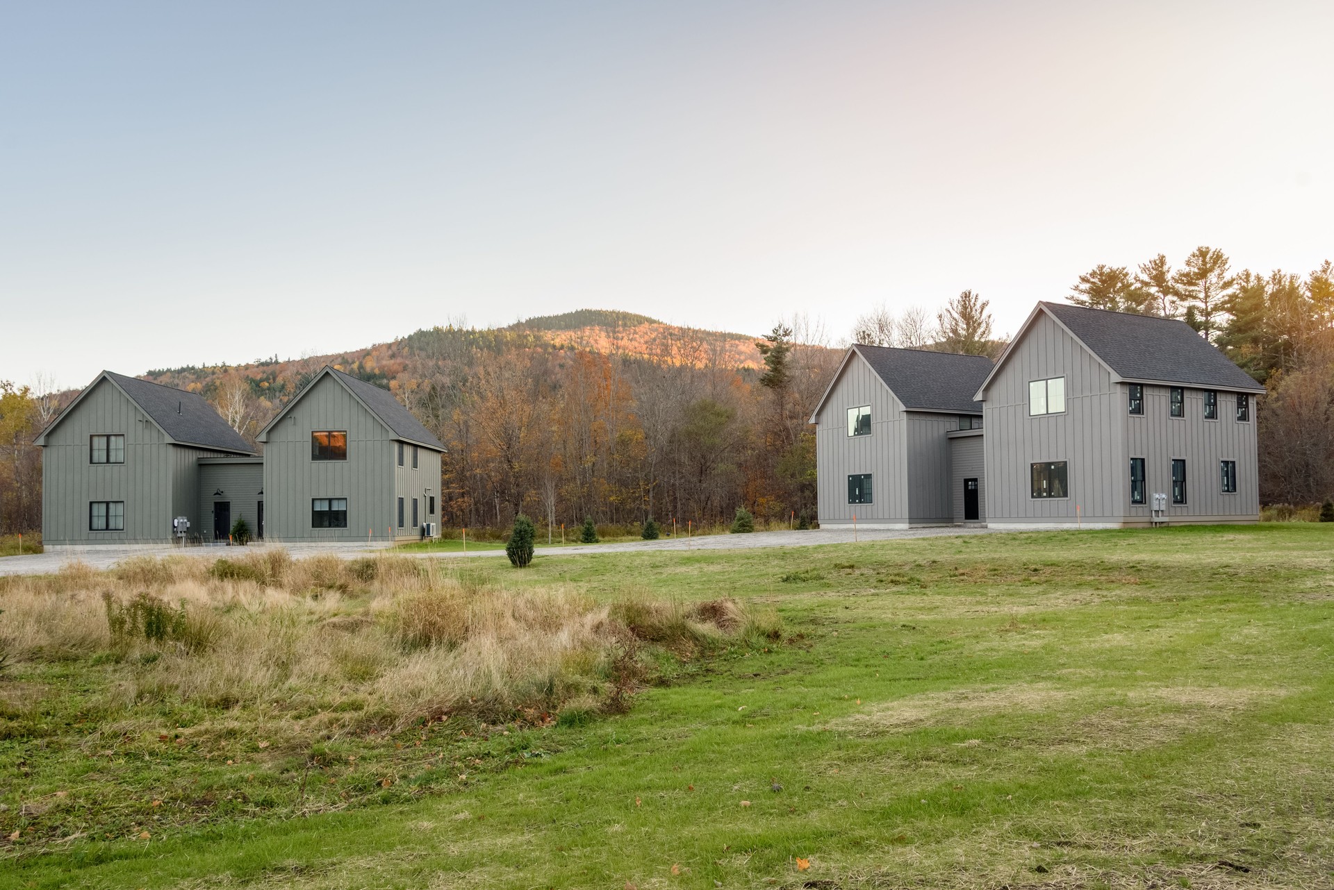 Housing development in a mountain setting at sunset in autumn